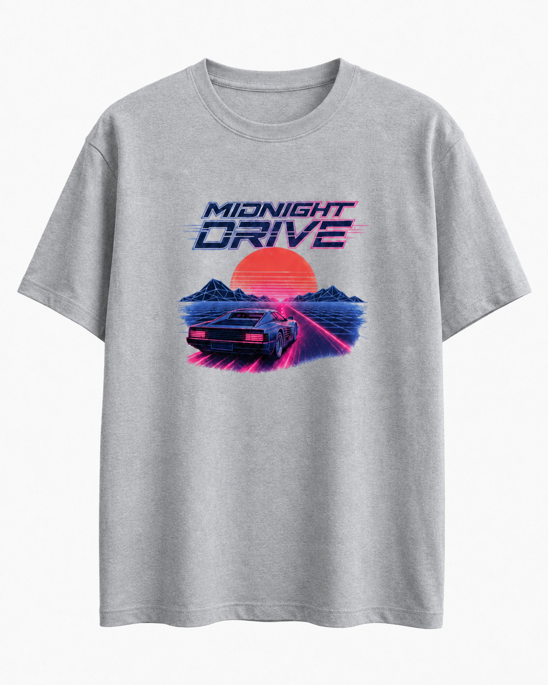 A light gray heather crewneck t-shirt featuring a retro 80s synthwave graphic with the text 'MIDNIGHT DRIVE' above a car, mountains, and a large orange sun.