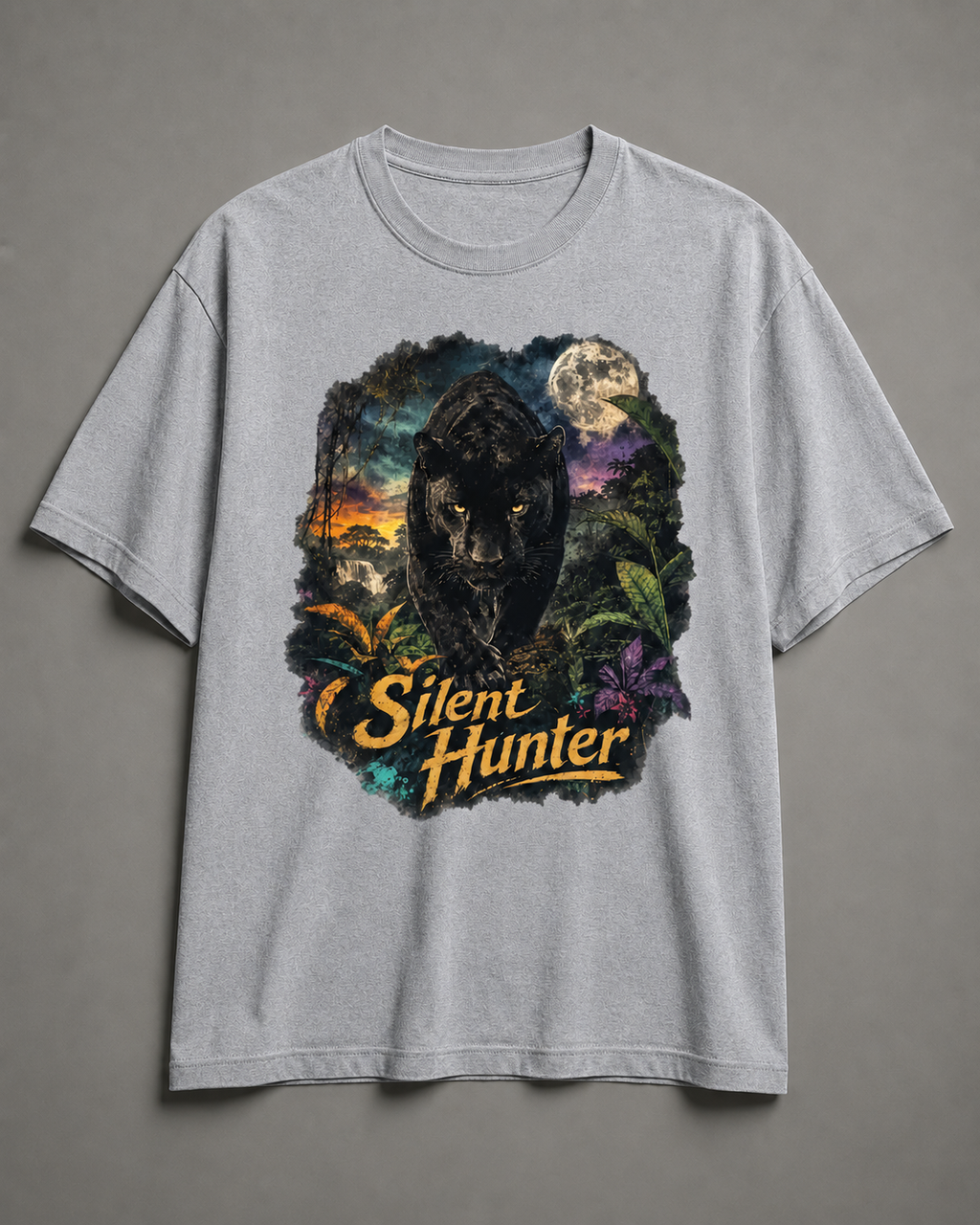 A light gray heather crewneck t-shirt featuring a large graphic print of a black panther in a jungle scene with a full moon and the text 'Silent Hunter' in yellow, displayed against a neutral gray background.