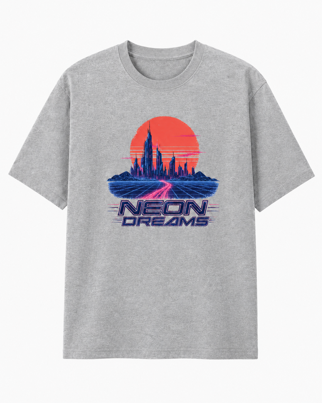 A heather gray short-sleeve t-shirt with a retro-futuristic graphic on the chest. The graphic features a large orange-red sun, a blue neon city skyline, a pink glowing path, and the text 'NEON DREAMS' in blue.
