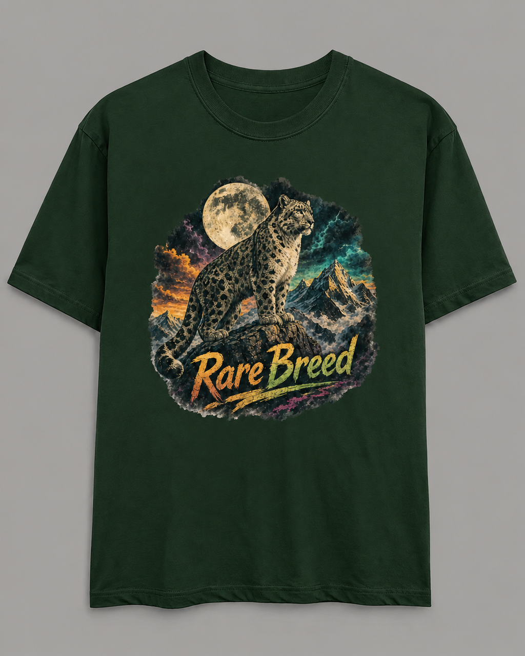 A dark forest green short-sleeve t-shirt with a circular graphic print of a snow leopard under a full moon with the text 'Rare Breed' written across the front, displayed on a neutral gray background.