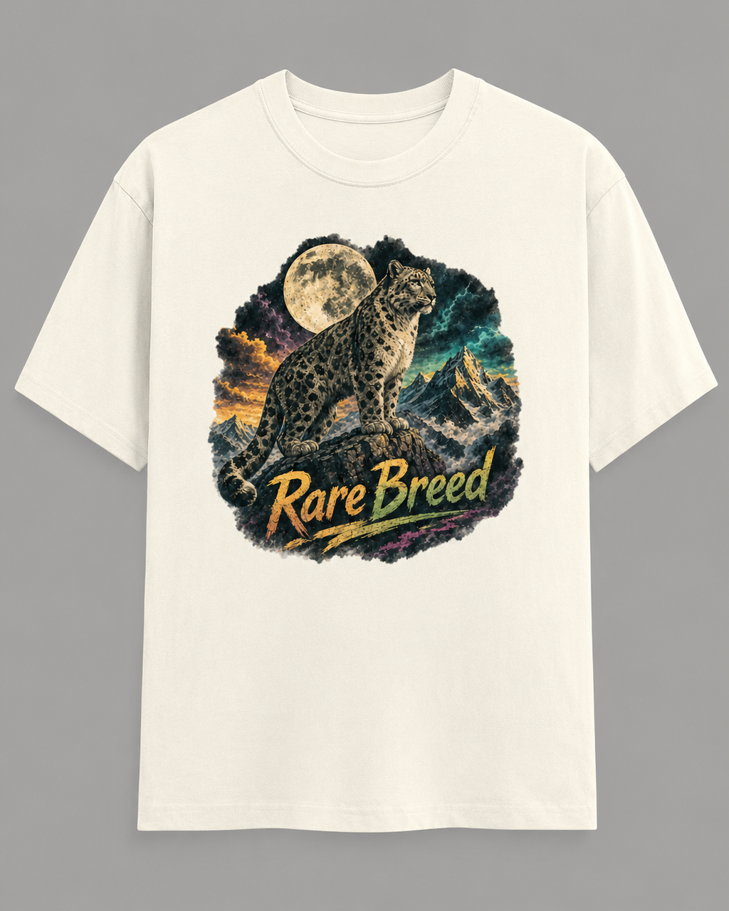 An off-white short-sleeve crewneck t-shirt featuring a circular graphic print of a snow leopard under a full moon with the text 'Rare Breed' in yellow, displayed against a solid gray background.