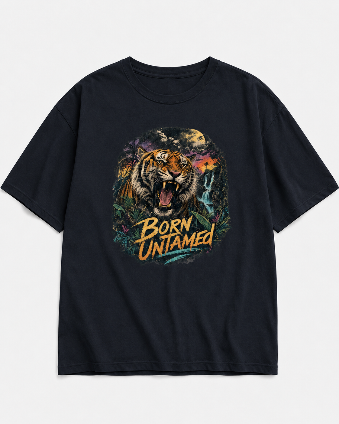A black short-sleeve crewneck t-shirt featuring a large graphic print of a roaring tiger in a jungle scene with the text 'BORN UNAMED' in yellow and orange, displayed on a light gray background.