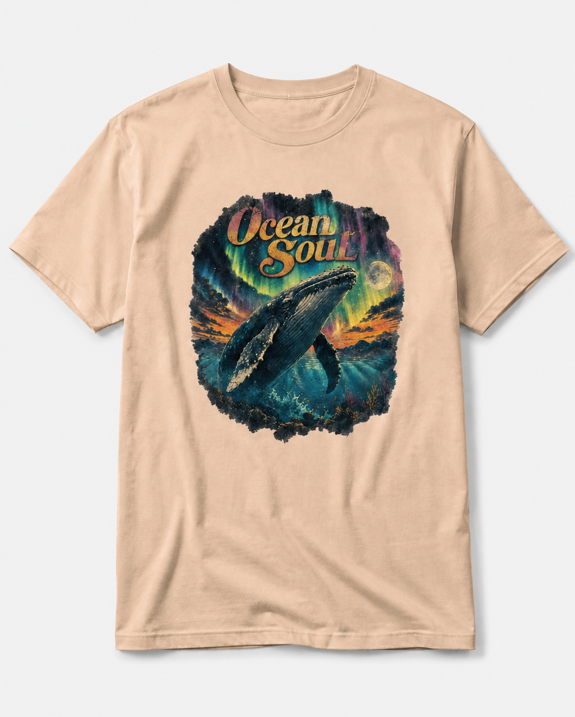 A light beige crewneck t-shirt featuring a colorful graphic print of a humpback whale under a vibrant aurora borealis sky with the text 'Ocean Soul' written in a retro gradient font.