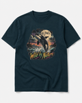 A dark navy blue short-sleeve t-shirt with a large graphic print on the front showing an orca whale, a full moon, and the text 'Wild by Nature' in yellow and orange.