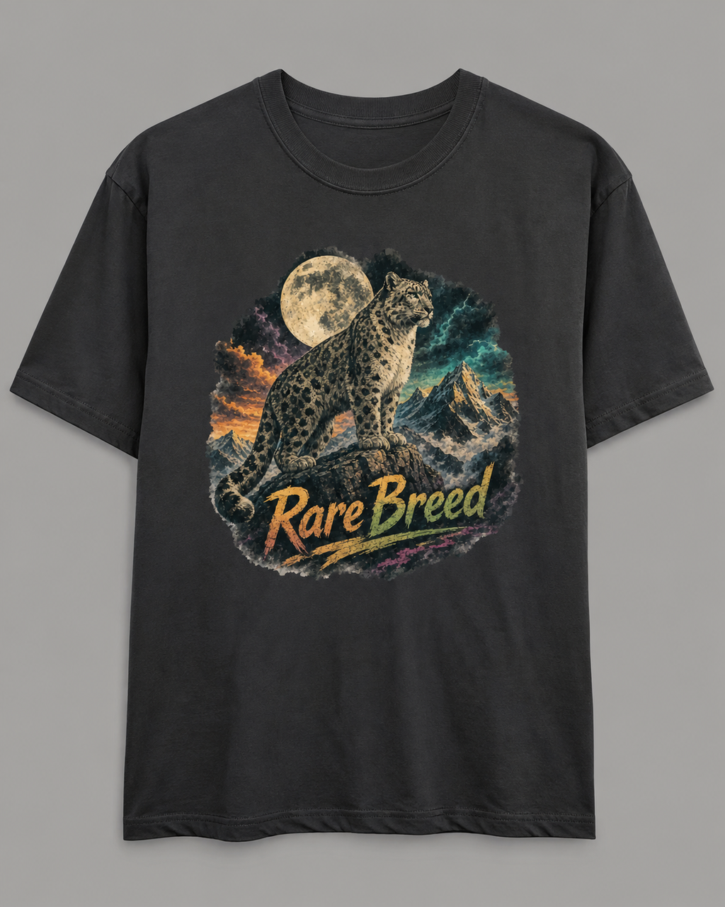 A black short-sleeve t-shirt with a graphic print of a snow leopard under a full moon and mountains, featuring the text 'Rare Breed' in a stylized font.