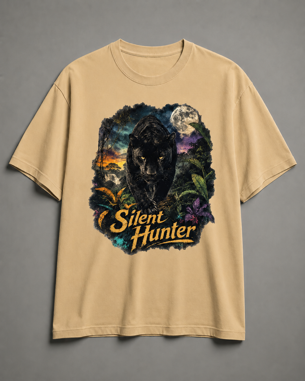 A beige short-sleeve t-shirt with a large graphic print of a black panther in a jungle scene under a full moon, with the text 'Silent Hunter' in yellow. The shirt is displayed flat against a neutral gray background.