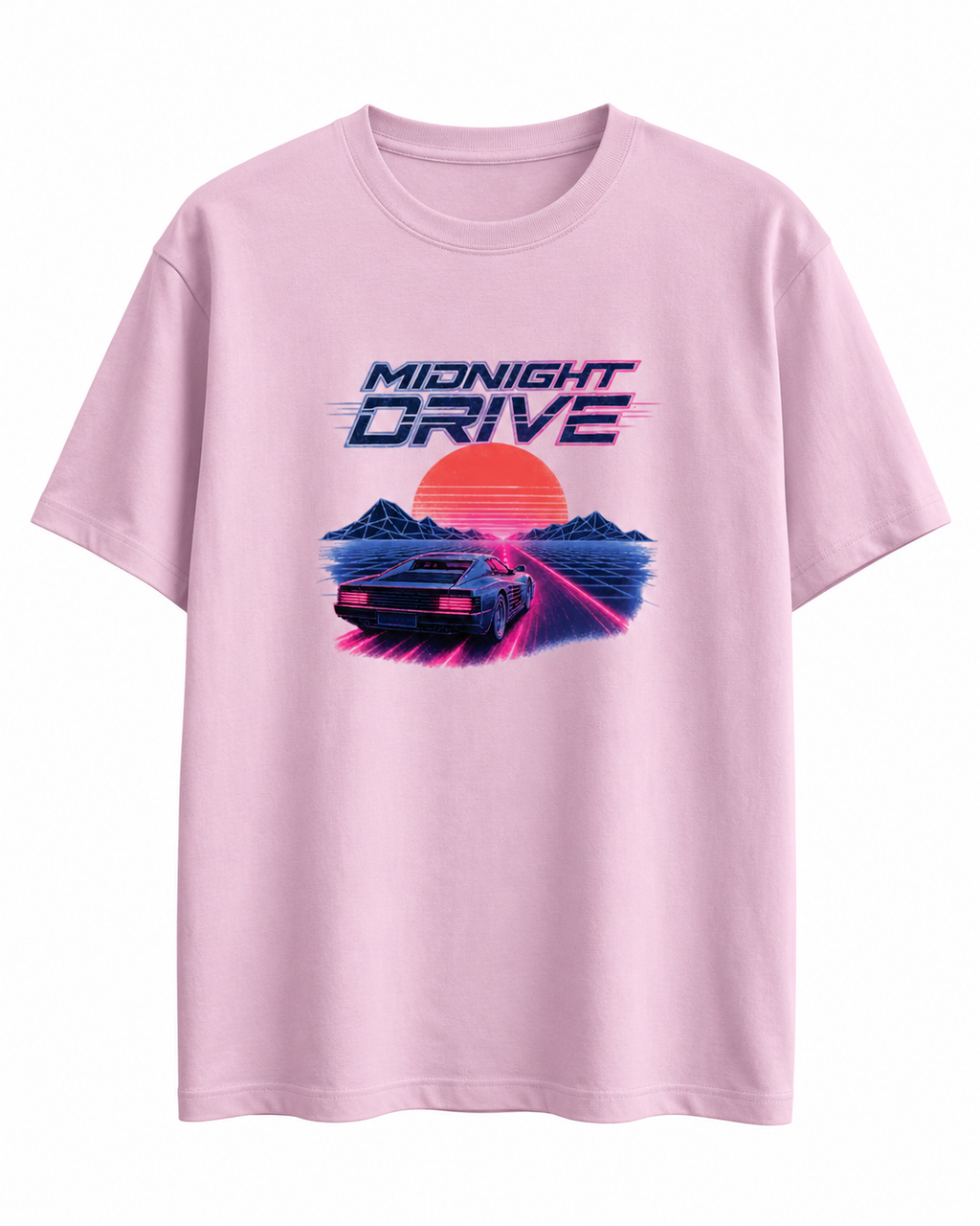 A light pink short-sleeve crewneck t-shirt featuring a retro 80s synthwave graphic on the front with the text 'MIDNIGHT DRIVE' and a car driving over a sunset landscape.